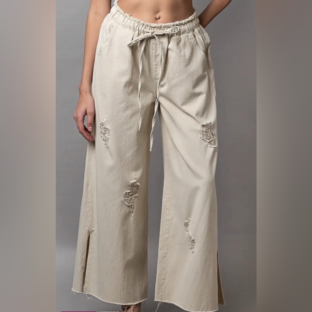 POL trouser with flare leg and drawstring closure.
Multiple sizes